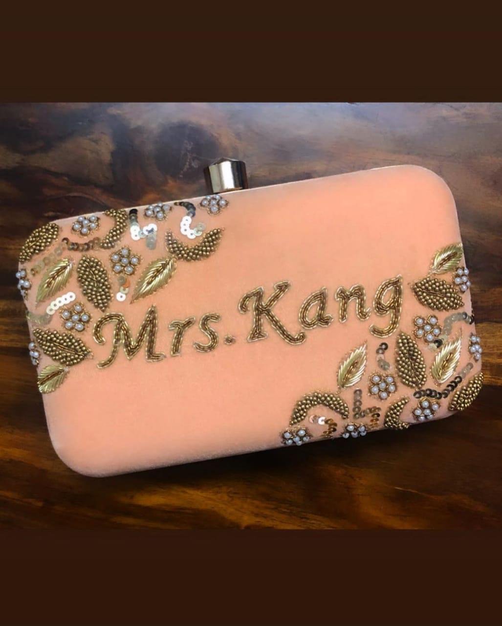 Customized embroidered apricot velvet clutch
