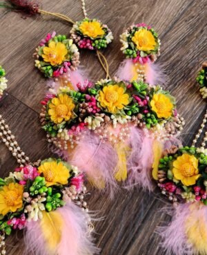 Buy yellow flower set with feathers for haldi function