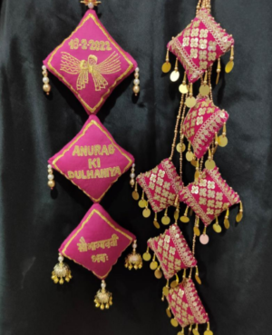 Pink customized lehenga latkan with tassel latkans
